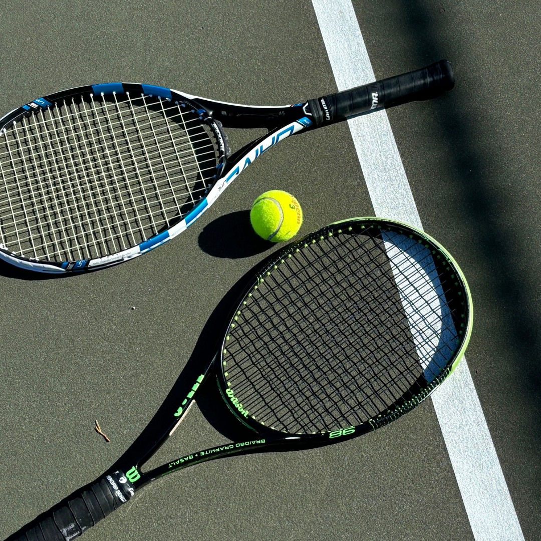 tennis ball with two rackets